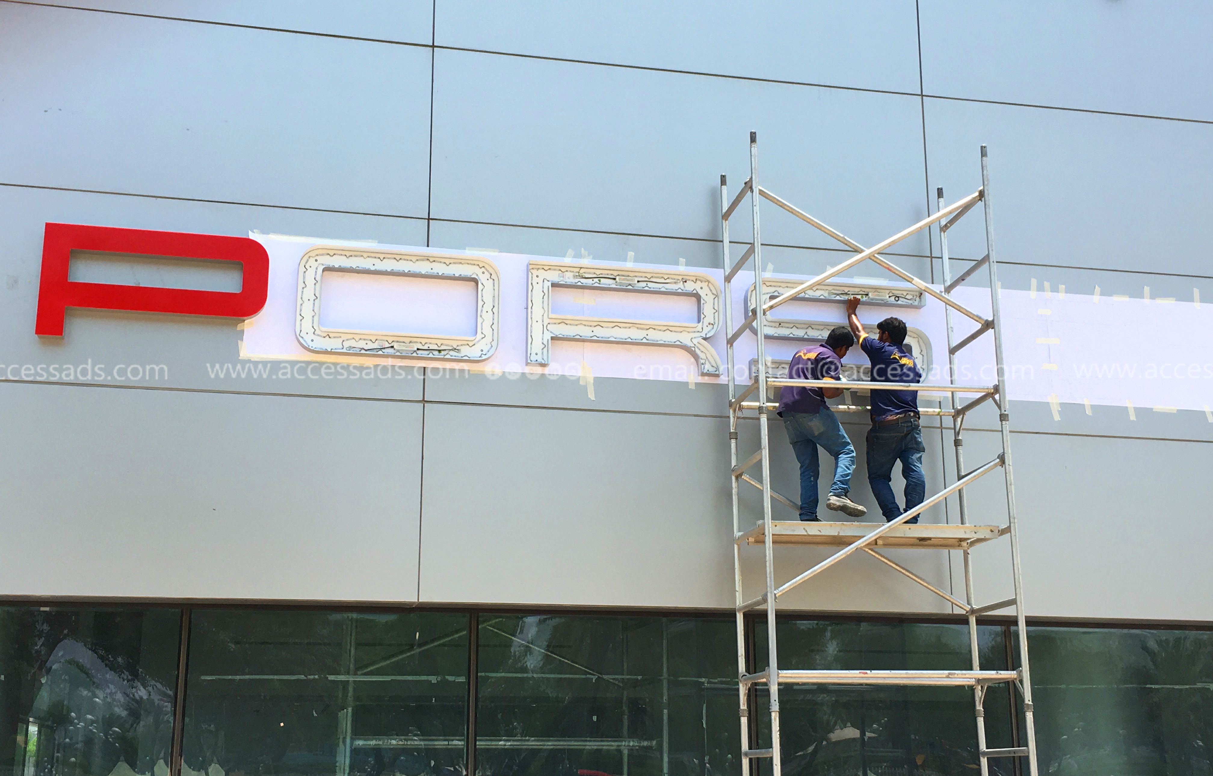 man working on a signage